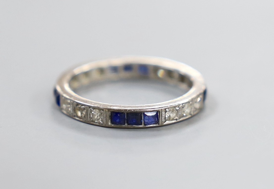 A white metal, square cut sapphire and round cut diamond set full eternity ring, size Q, gross weight 3.8 grams.